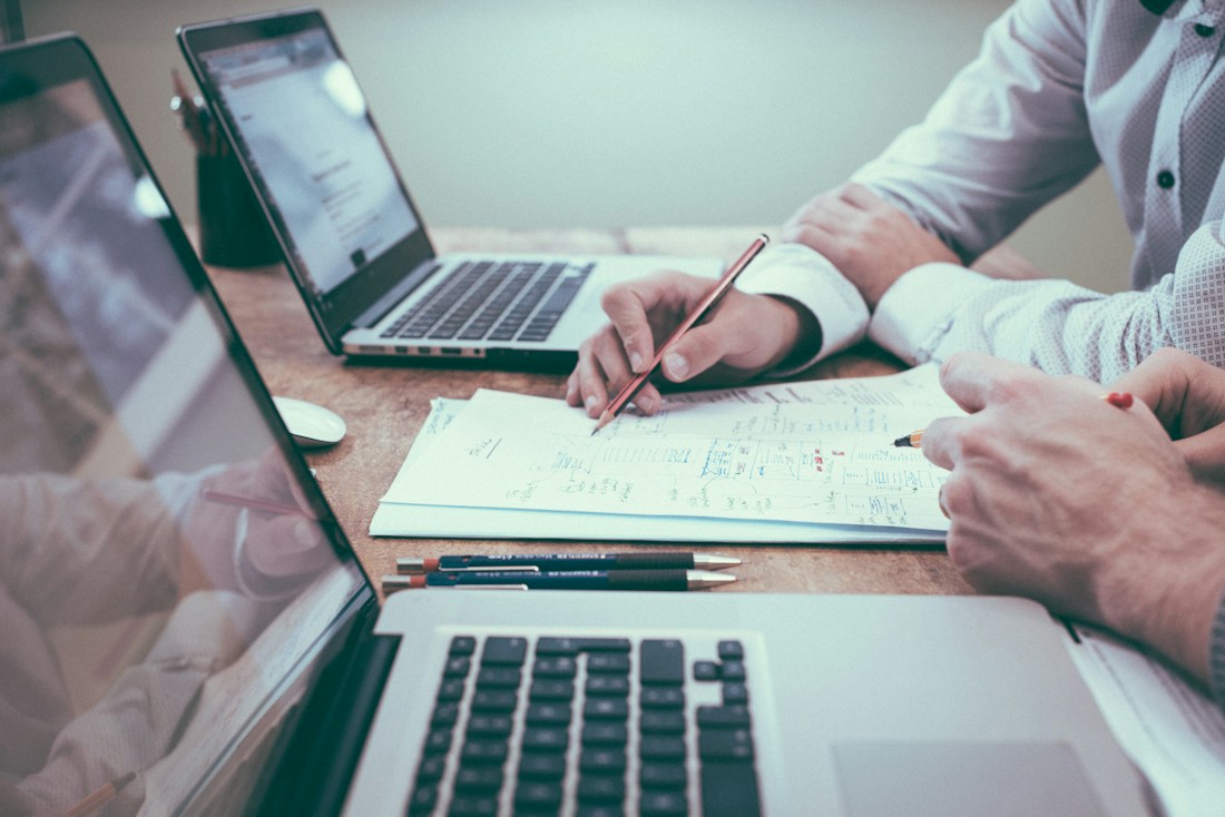People reviewing financial charts and planning documents